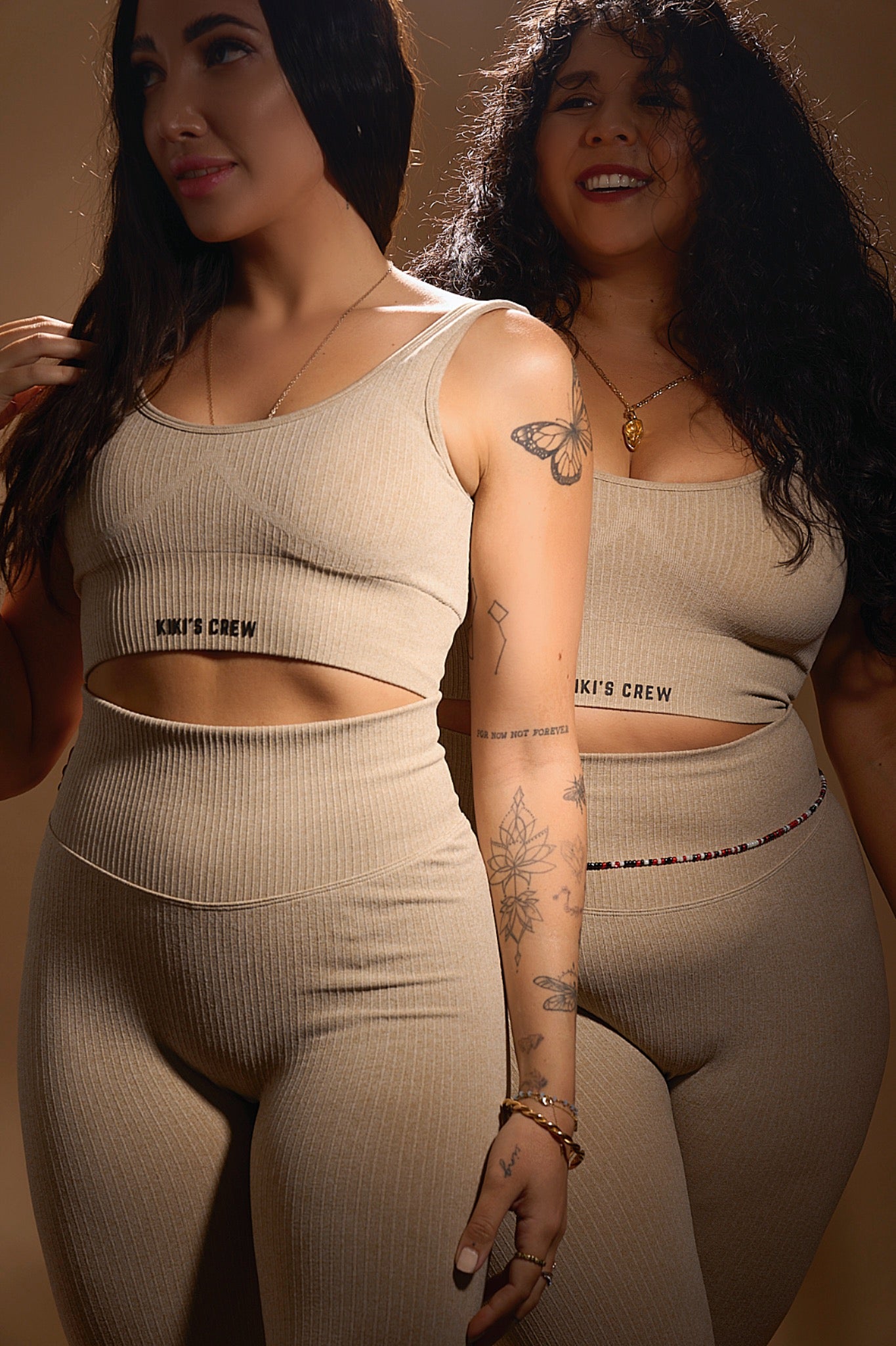 Model 1 and 2 together wearing the kiki's crew matching sports top and leggings, color beige, size small and size large