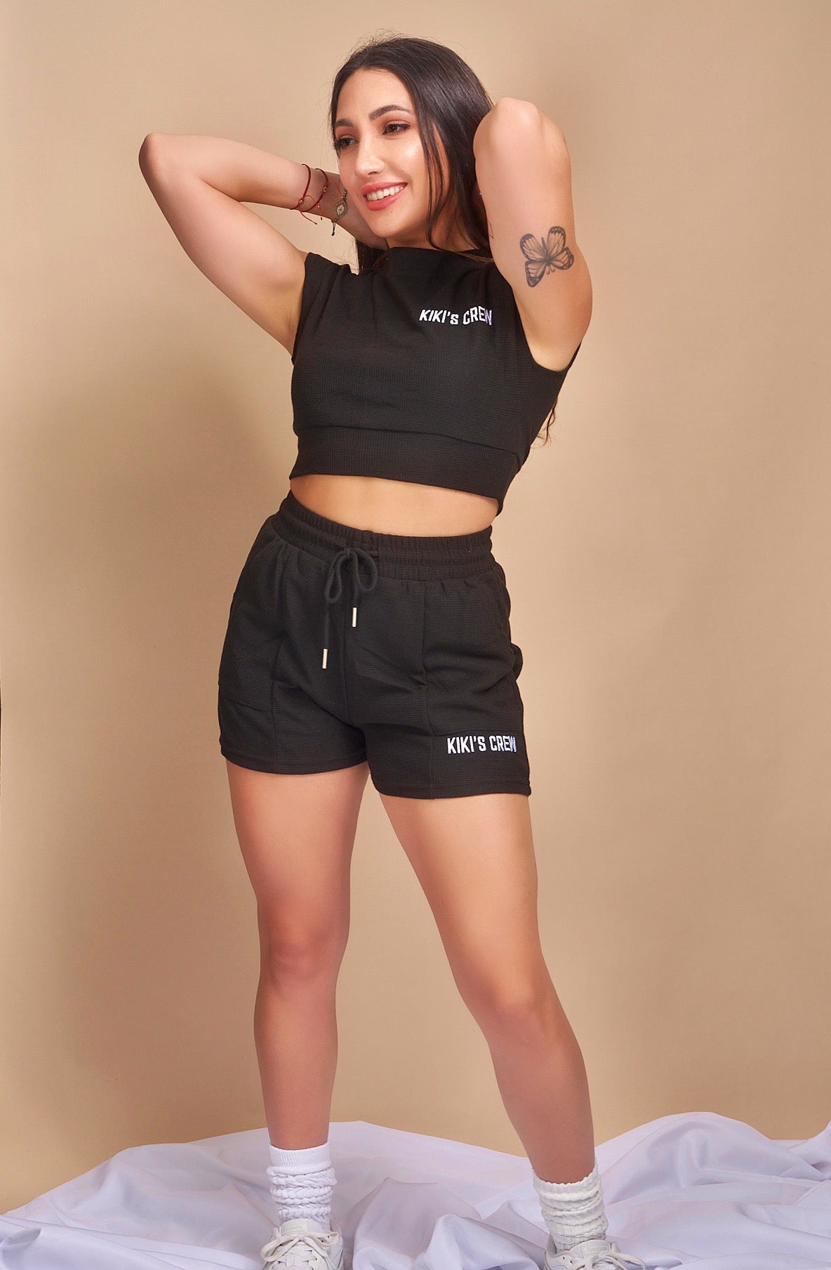 Model 1 wearing size small of the kiki's crew boxing set 