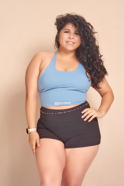 Model 2 wearing size large of the kiki's crew basic spandex shorts along with size large of kiki's crew baby blue sports tank top 